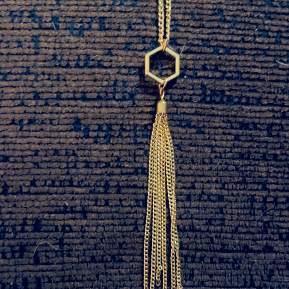 Gold long woman’s necklace with gold centerpiece
